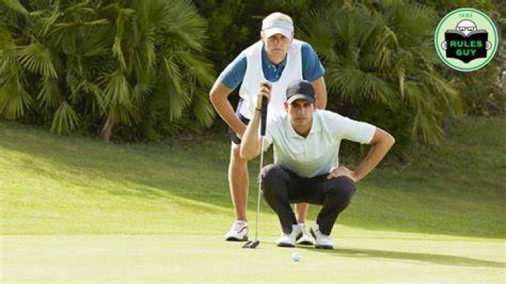 Can a caddie touch the green?