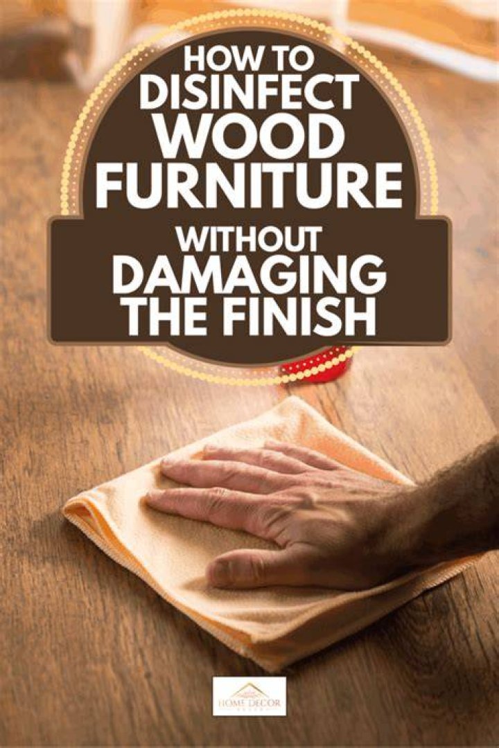 How do you disinfect wood furniture without damaging the finish?